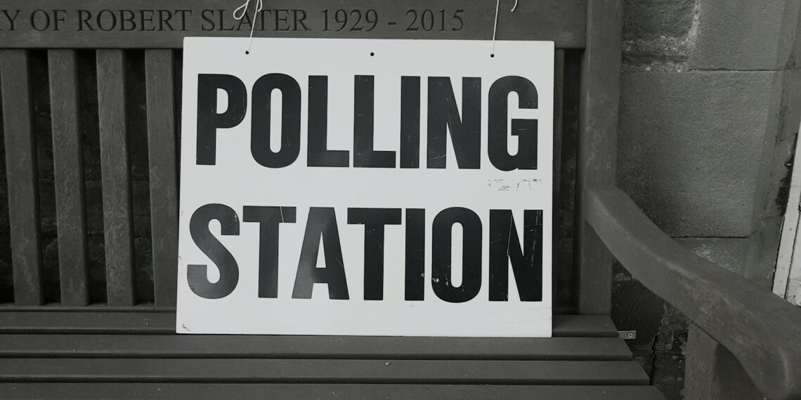 bench with polling station sign