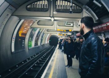 people standing in train station