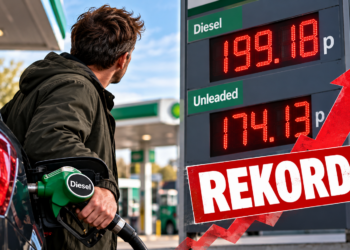 Kierowca tankujący diesel przy tablicy z rekordową ceną 199,18p za litr