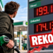 Kierowca tankujący diesel przy tablicy z rekordową ceną 199,18p za litr